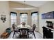 Kitchen nook with a glass-top table and chairs, with view to backyard at 2178 Sunstone Dr, Lakeland, FL 33813