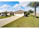 White garage door with a neatly landscaped front yard at 2178 Sunstone Dr, Lakeland, FL 33813