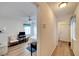 Clean hallway with wood-look floors and access to laundry and bedroom at 2178 Sunstone Dr, Lakeland, FL 33813
