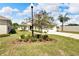 House exterior with landscaping and a lamp post at 2178 Sunstone Dr, Lakeland, FL 33813
