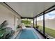Relaxing screened porch with patio furniture and view of backyard at 2178 Sunstone Dr, Lakeland, FL 33813