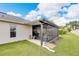 Covered screened porch with a small patio area at 2178 Sunstone Dr, Lakeland, FL 33813