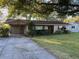 House exterior showcasing a carport and well-maintained lawn at 3022 21St Nw St, Winter Haven, FL 33881