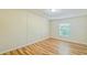 Well-lit bedroom showcasing wood-look flooring at 408 Garrett Ridge Ct, Winter Haven, FL 33880