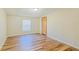Simple bedroom featuring wood-look floors and a window at 408 Garrett Ridge Ct, Winter Haven, FL 33880