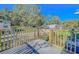 Wooden deck with gate overlooking backyard at 408 Garrett Ridge Ct, Winter Haven, FL 33880