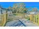Wooden deck with gate overlooking backyard at 408 Garrett Ridge Ct, Winter Haven, FL 33880
