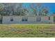 Mobile home exterior view with grassy yard at 408 Garrett Ridge Ct, Winter Haven, FL 33880