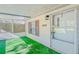 Mobile home exterior with covered porch and green grass at 408 Garrett Ridge Ct, Winter Haven, FL 33880