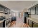 Spacious kitchen with stainless steel appliances and wood-look flooring at 408 Garrett Ridge Ct, Winter Haven, FL 33880