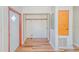 Small laundry room with wood-look floors and shelving at 408 Garrett Ridge Ct, Winter Haven, FL 33880
