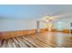 Large living area with wood-look floors and ceiling fan at 408 Garrett Ridge Ct, Winter Haven, FL 33880