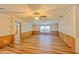 Bright living room with wood-look floors and ceiling fan at 408 Garrett Ridge Ct, Winter Haven, FL 33880