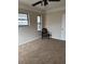 Empty bedroom with neutral walls, plush carpet, and a ceiling fan at 503 Se 3Rd St, Mulberry, FL 33860