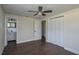 Spacious bedroom with dark wood floors and ceiling fan at 505 N Polk Ave, Fort Meade, FL 33841