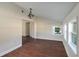 Bright dining room with dark wood floors and chandelier at 505 N Polk Ave, Fort Meade, FL 33841