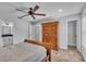 Main bedroom with ceiling fan, ensuite bathroom, and walk-in closet at 5427 Moon Valley Dr, Lakeland, FL 33812