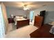 Spacious bedroom with wooden furniture and carpeted floors at 554 Harbourview Dr, Haines City, FL 33844