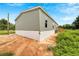 Exterior view showcasing the home's siding and landscaping at 10109 Old Spanish Trl, Polk City, FL 33868