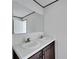Double vanity with dark wood cabinets in the bathroom at 10109 Old Spanish Trl, Polk City, FL 33868