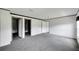 Bright bedroom with grey carpet and access to bathroom at 10109 Old Spanish Trl, Polk City, FL 33868