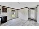 Bright dining area with wood-look flooring and large window at 10109 Old Spanish Trl, Polk City, FL 33868