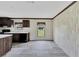 Bright dining area with wood-look flooring and large window at 10109 Old Spanish Trl, Polk City, FL 33868