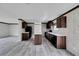 Kitchen with dark brown cabinets and a large island at 10109 Old Spanish Trl, Polk City, FL 33868