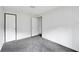 Spacious bedroom with grey carpet and two closets at 10109 Old Spanish Trl, Polk City, FL 33868