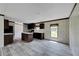 Kitchen features dark brown cabinets, an island, and gray flooring at 10109 Old Spanish Trl, Polk City, FL 33868