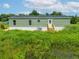 Exterior view of the house and backyard at 10109 Old Spanish Trl, Polk City, FL 33868