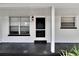 Renovated front porch with black and white details at 905 14Th Ne St, Winter Haven, FL 33881