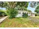 White Ranch home with mature landscaping at 905 14Th Ne St, Winter Haven, FL 33881