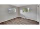 Simple bedroom with wood-look floors and neutral walls at 905 14Th Ne St, Winter Haven, FL 33881
