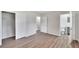 Bright bedroom with wood-look floors and spacious closet at 905 14Th Ne St, Winter Haven, FL 33881