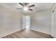 Bright bedroom with wood-look floors and ceiling fan at 905 14Th Ne St, Winter Haven, FL 33881
