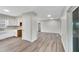 Kitchen features white cabinets and wood-look floors at 905 14Th Ne St, Winter Haven, FL 33881