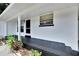 Front porch with dark-colored stamped concrete at 905 14Th Ne St, Winter Haven, FL 33881