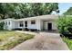 Front view of a renovated ranch home with carport at 905 14Th Ne St, Winter Haven, FL 33881