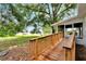 Wooden ramp and screened porch, providing backyard access at 905 14Th Ne St, Winter Haven, FL 33881