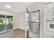 Kitchen with sliding door access to screened patio at 905 14Th Ne St, Winter Haven, FL 33881