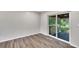 Dining room with wood-look floors and sliding glass doors to a patio at 905 14Th Ne St, Winter Haven, FL 33881