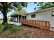 Home's side yard with ramp access to screened porch at 905 14Th Ne St, Winter Haven, FL 33881