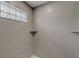 Walk-in shower with gray tile and glass block window at 4736 Puritan Ln, Lakeland, FL 33810