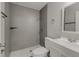 Updated bathroom with gray tile shower and white vanity at 4736 Puritan Ln, Lakeland, FL 33810