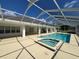 Relaxing pool and spa area with screened enclosure at 2418 Berkshire Dr, Winter Haven, FL 33884