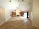 Spacious living room features a large stone fireplace and built-in shelving at 2418 Berkshire Dr, Winter Haven, FL 33884