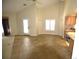 Open living area with tile floors and access to the kitchen at 2418 Berkshire Dr, Winter Haven, FL 33884