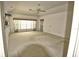 Spacious living room with carpet and large windows at 2418 Berkshire Dr, Winter Haven, FL 33884