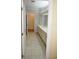 Bright bathroom with double vanity and updated tile flooring at 2418 Berkshire Dr, Winter Haven, FL 33884